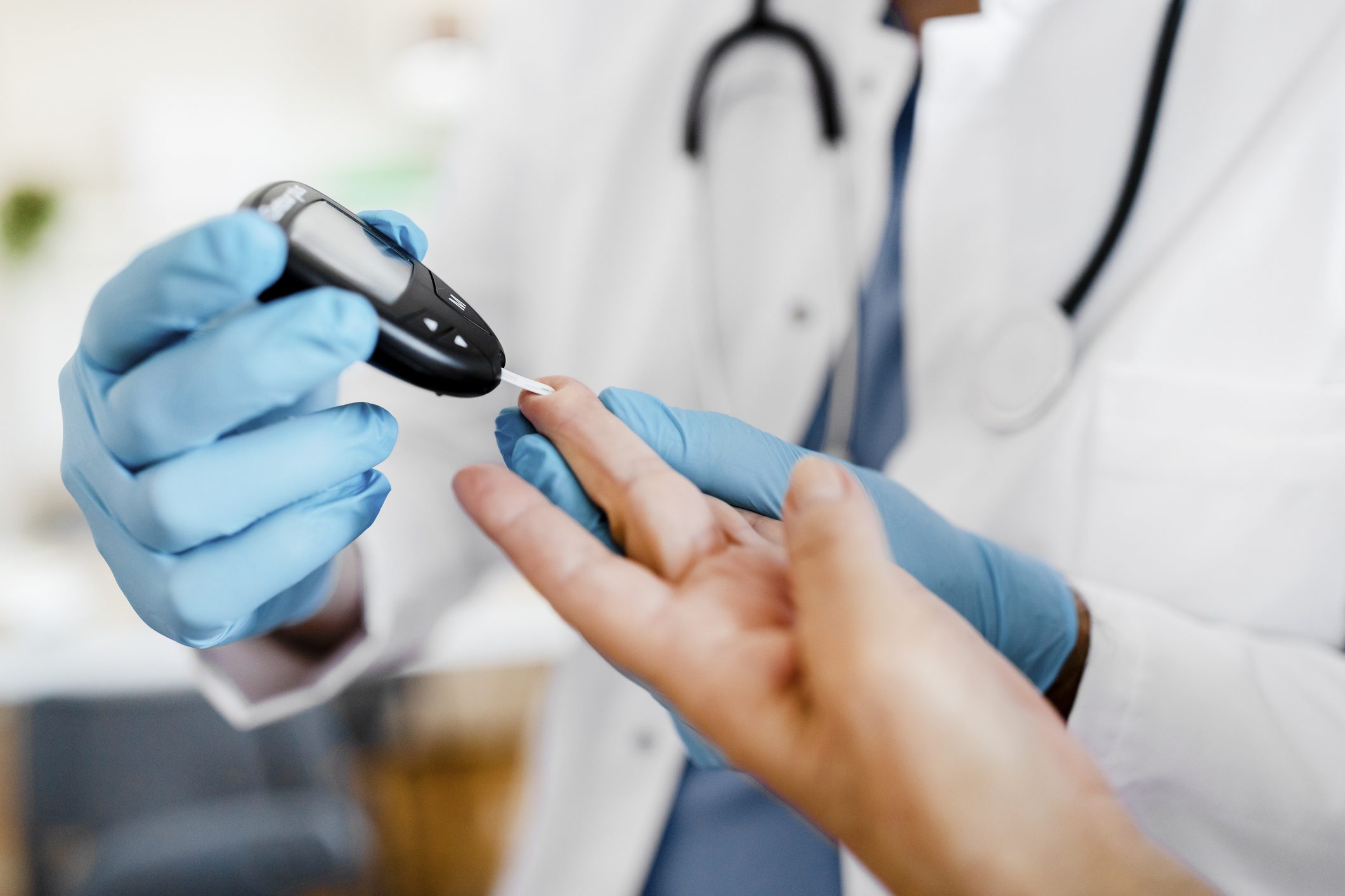 Doctor checking blood sugar level