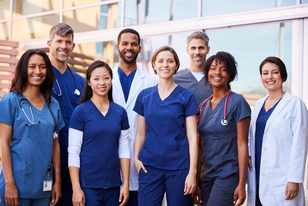 Diverse medical team smiling together
