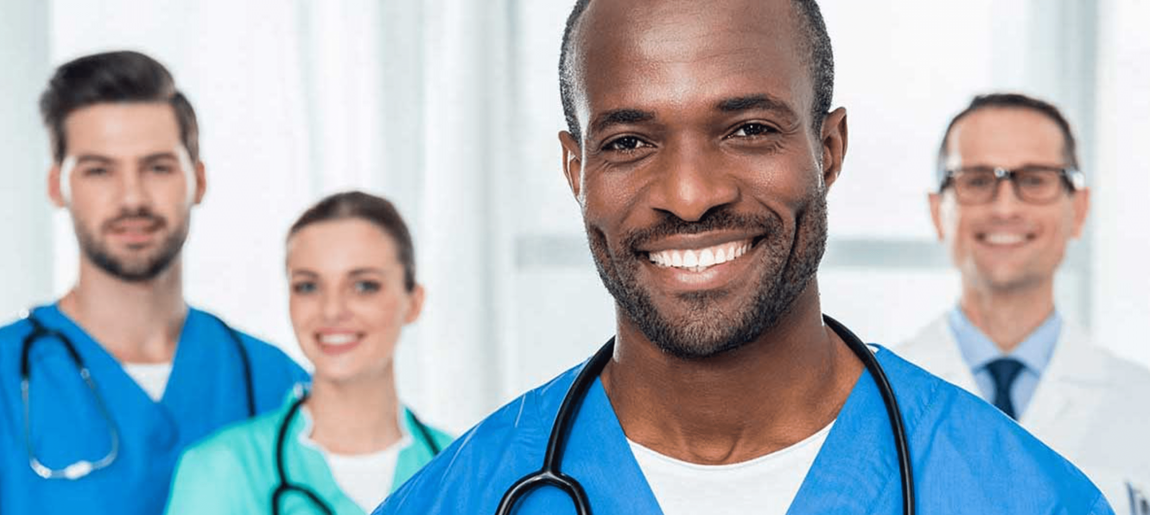 Smiling medical professionals in uniforms