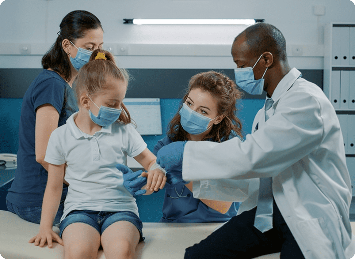 Child receiving medical care from doctor